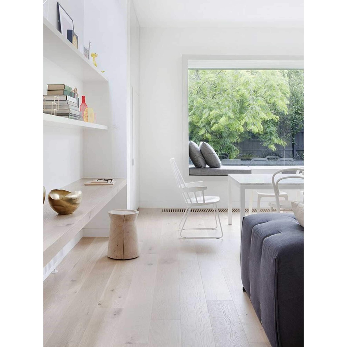 Light timber flooring in a furnished living space